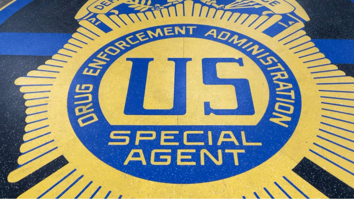 Load video: Waterjet cut Logo for the U.S. Dept. of Justice, Drug Enforcement Administration. Material: rubber.